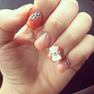 Fun summery nails with glitter, bows and bling to top it all of for some summer fun 