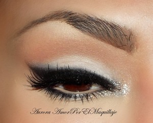 http://www.youtube.com/watch?v=k_N8S8Hdzd4


1. Prime your eyelids with a base or corrector
2. Apply Mylar e/s of MAC on brow bone and mobile eyelid
3. Line your top lashes with an Black Gel Liner & blend the edges
4.Set the black eyeliner with a Carbon e/s of MAC
5.Blur a little amount of Carbon e/s below lower lashes
6.Place a white bright pigment on the inner corner 
7. Apply false lashes like Ardell Demi Wispies
8. Finish the look adding black mascara.