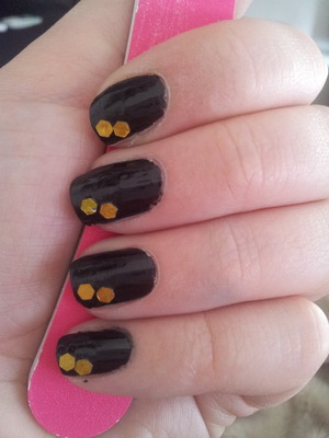 black nails with a bit gold