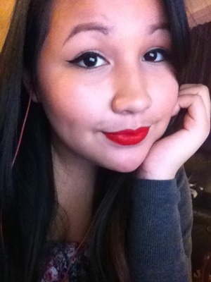 I use maybelline's eyestudio gel eyeliner and I paired it with Mac's ruby woo :)