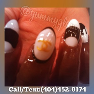 Black and White Oval Acrylic Nails with Chanel Theme. 