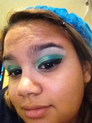 My school colors are green and white so for home coming that's what I did a dramatic green eye with a stark unblinded white highlight and green barbie eye circle lense ( cant really tell their green :( ) to show my school pride! 