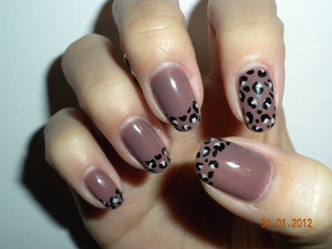 Taking the same grey taupe gel nails to another level with leopard print tips and accent nails