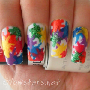 A splatter mani created using a dotting tool.