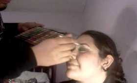 My brother doing my makeup