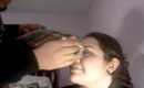 My brother doing my makeup