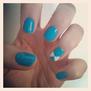 Bright blue nails with a bow accent nail