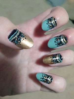 gold and turquoise lace patterned nail art
