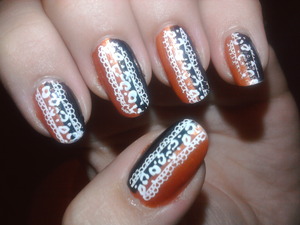 I like this design a lot, half of the nail orange and the other black looks great. It looks so interesting. To kinda hide the harsh line and add something special, I added the konad design. I hope you like it. More info and more designs on my blog: http://nailartbylynn.tumblr.com/