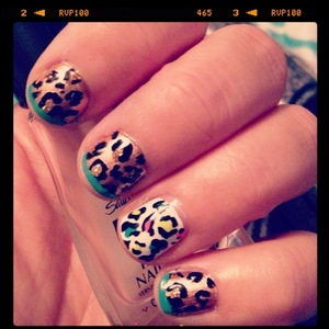 China Glaze "Honesty" (i think!) base with teal tips and gold middle dot...plus a neon leopard ring finger ;)