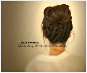 Braided ponytail into a perfect messy bun hair tutorial can be found here. <3

http://www.makeupwearables.com/2013/08/cute-school-hairstyles-updos-with.html

http://www.youtube.com/watch?v=P34YrMJcf24