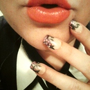 Pink lips with grapevine nails