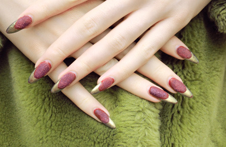 Stella is set for a classic Christmas in the Ciaté Velvet Manicure in Berry Poncho, and gold tips done in Chanel Peridot.