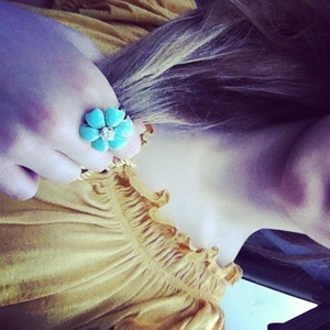A turquoise ring added to your yellow blouse = fun and girly