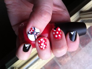 I am so excited about going to Disney World in a few weeks that I am already practicing my nail art for the trip. These were actually really easy especially if you do what I did and do Minnie on your non-dominant hand and Mickey for the dominant hand (see the other hand on my photos page). 