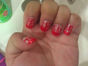 Bloody Halloween Nails (: I used a cheep Halloween red nail polish from the Party store and cheep fake nails for this because my nails were too short for this look at the time. Also to make the drippy blood look I used a pin to drag the polish from the ti
