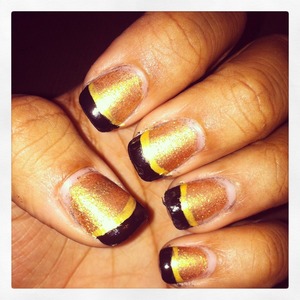 Black and gold nails with a gold matte topcoat 