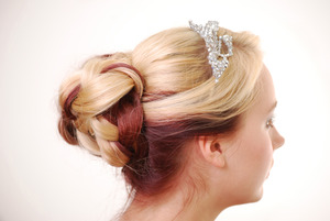 Prom updo - Plaited bun with long blonde hair and red panel underneath