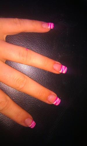 White and pink zebra effect nail tips.