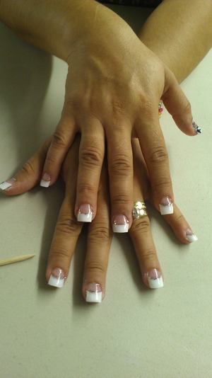 French tips with a glitter line at the bottom edge.