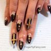 Black nails with gold studs 