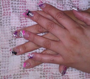 i did my own full tip acrylic set w/ CND acrylic w/ 3d color acrylic bows and zebra and leopard print  