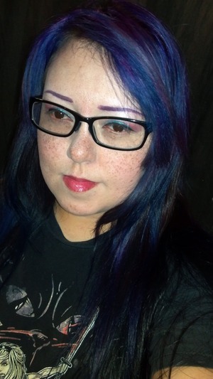 Recently covered up my hot pink hair with a combination of purple and dark blue. The result was an awesome black-light purple effect. 
