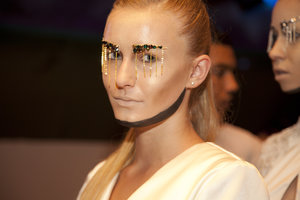 Backstage image from a fashion show that i was head make up artist ! removed the eyebrows with kryolan eyebrow design kit and created the add ons !