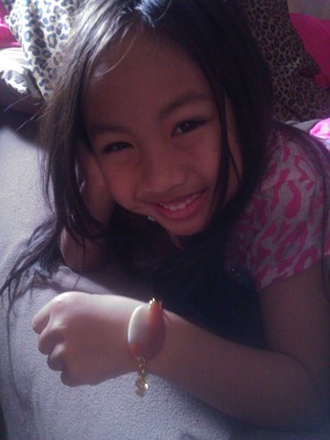 Sophia modelling the first bracelet I designed and made!