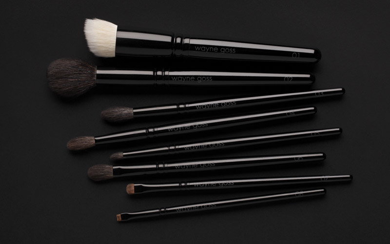 The Wayne Goss Collection, all 8 brushes in the colleciton lying flat showing scale and labels.