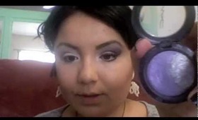 Smokey purple eye shadow.