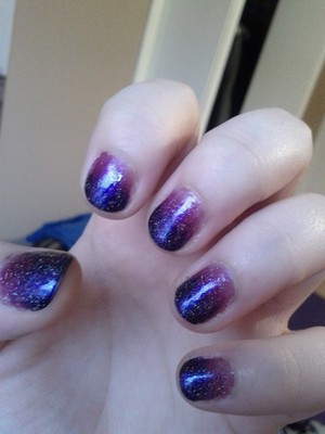 gradient manicure in purple with a glitter top coat.