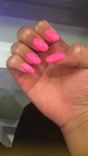 Rounded shaped neon pink nails
