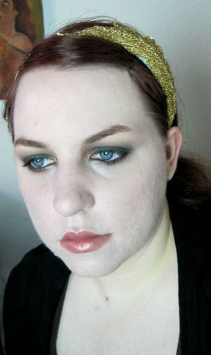 I'm trying to create looks for all of the main characters in LOTR; this is my look inspired by Aragorn using his eyeshadow from my One Ring collection, Strider.

Strider is a matte dark hunter green and its what I used all over the lid and the lower lashline. I blended that out with another matte color from the same collection, Wise Wizard which is a matte medium gray with blue undertones. 

On the lips is the lip butter included with my One Ring collection, Evenstar, which is inspired by Liv Tyler's natural look berry tinged lip color in the films. 

You can purchase Pumpkin and Poppy products at my artfire store:
http://www.artfire.com/ext/shop/studio/pumpkinandpoppy