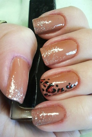 Nude nails with glittery tips and a black and red leopatd accent nail. Added a leopard heart for extra cuteness :)