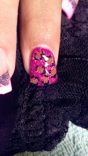 Cheetah print nails done with micro beads