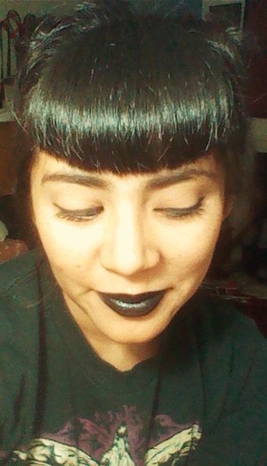 This was me trying out my new black lipstick from Portland's Black Lipstick Company...check them out, they have all kinds of crazy colors. It went on super smooth and one swipe is enough because it is super pigmented. It isn't in the shape of regular lipstick though, it's like a chap stick so you will have to bust out a lip brush for your cupid's bow. Not too expensive but you do have to pay for shipping so my order was around $15 with one lipstick, a sample, and shipping.