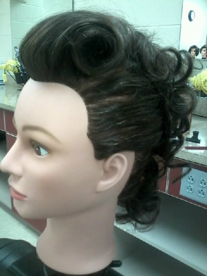 I styled this after a roller set into this cute mohawk-like retro hair-do. Done in my cosmetology class. :)