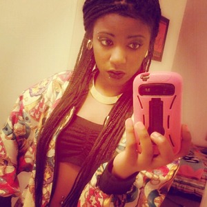 Black lipstick, thrifted jacket, black bandeau, stud earrings, gold necklace, and box braids :)