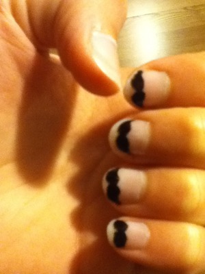 Products Used:
- light pink nail polish
- black nail polish