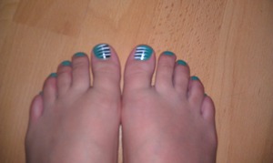 Base is Sally Hansen Insta-dri 440 Mint Sprint and stripes are Kiss Nail Art Paint in black and white.