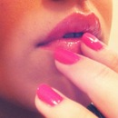 Hot pink nails.