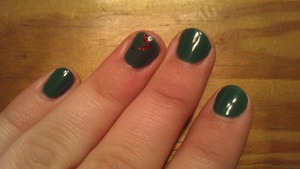 Deep green with the accent finger having red sparkles :) 