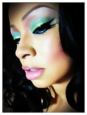 Pastel colors, pinks, light green with a touch of frost. Winged eye liner and rose blush.
