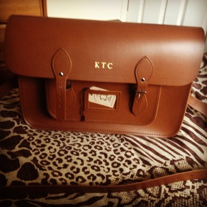 I just love my 15" brown real leather satchel I use it daily!
