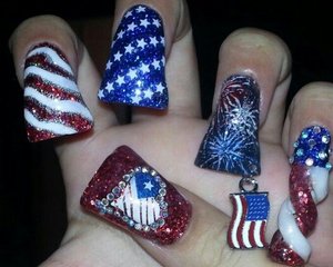 Spiral American flag nail, fireworks nail with american flag nail dangle,  stars and stripes nails and American flag heart thumb.