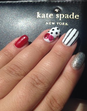 Red black and white nails with stripes, polka dots and roses 