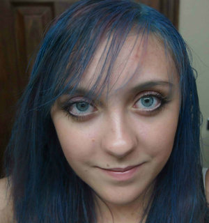 The red in my hair faded very quickly so I decided to experiment and temporarily dye it blue until Wednesday when I will be redyeing red again.  I used Splat Washable color in the color Electric Blue.