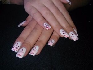 these are wonderful gel nails i made. i made white base sexier with some ferarri red and magenta red dots in curled lines over whole nail. (: i love this work.. can't wait nxt. (: