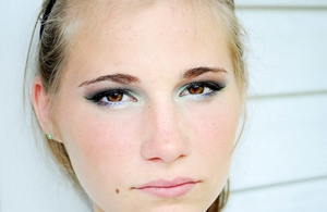 traditional smokey eye with a hint of green in the corners of the eyes and on the cat eyes.